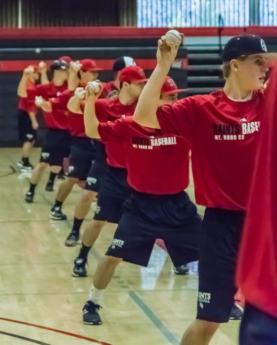 The team works on drills during practice in the gym.