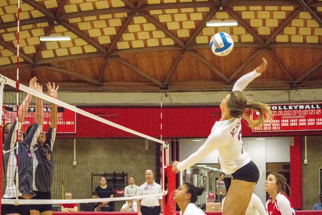 Dannell Woodcock leaping for a kill shot against Clark College on Wednesday Oct. 12 in the three set loss.