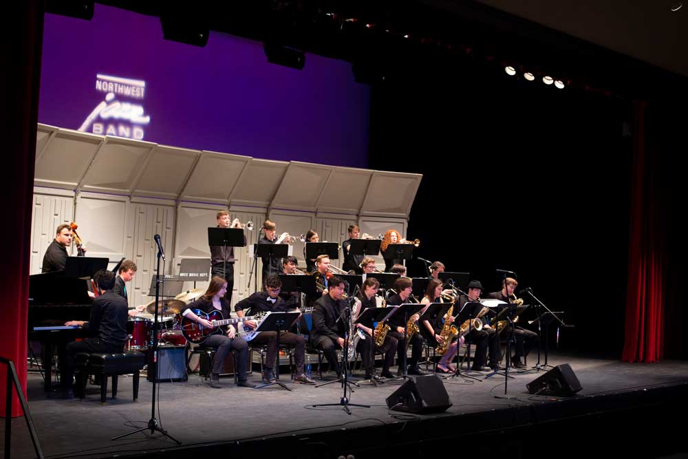 Group of students playing in a school band.