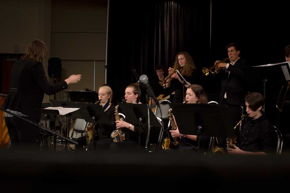 Group of students playing in a school band.