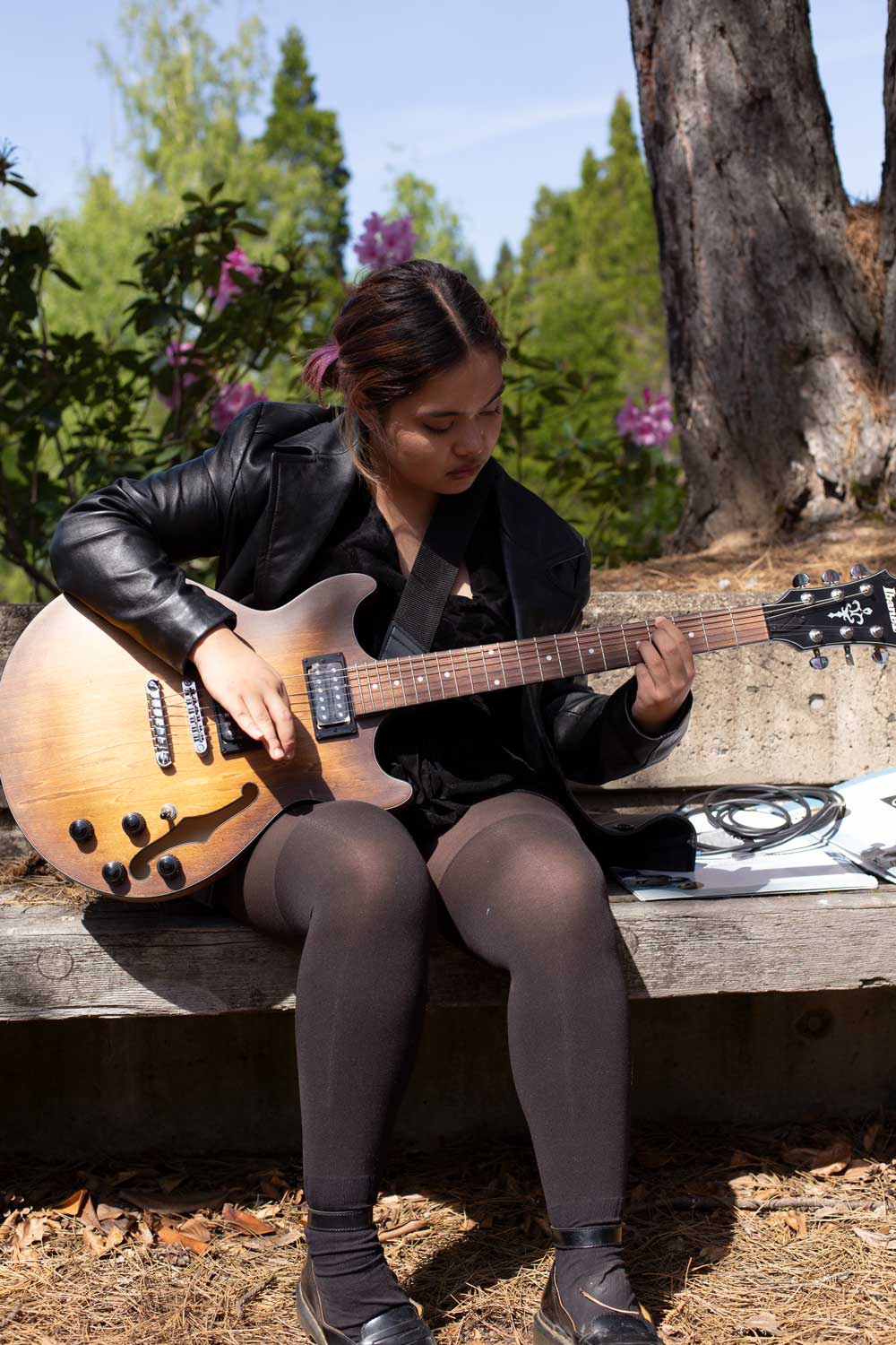 A student playing the guitar